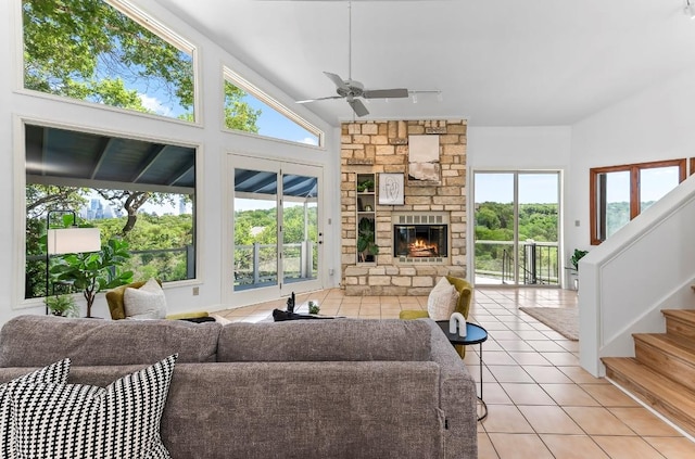1313 Spyglass Dr, Austin, TX 78746 - living area featuring light tile patterned floors, plenty of natural light, and a ceiling fan