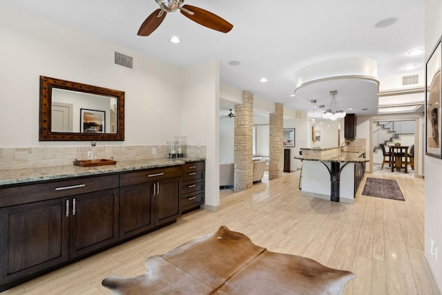 9 Swiftwater Trl, The Hills, TX 78738 - full bathroom featuring a ceiling fan, tasteful backsplash, ornate columns, vanity, and recessed lighting