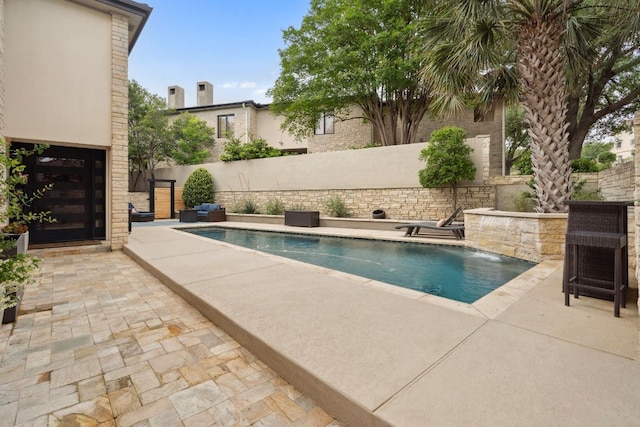 9 Swiftwater Trl, The Hills, TX 78738 - view of swimming pool featuring a patio and a fenced backyard