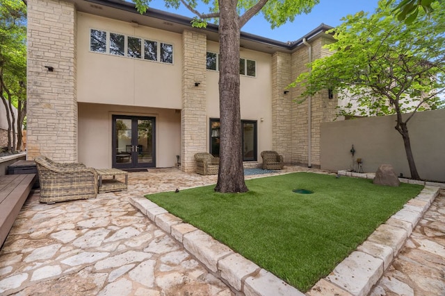 9 Swiftwater Trl, The Hills, TX 78738 - back of house with french doors, stucco siding, and a patio