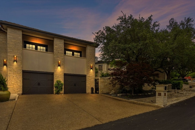 9 Swiftwater Trl, The Hills, TX 78738 - view of front of home featuring stone siding and a garage