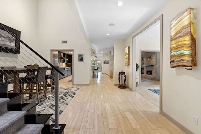 9 Swiftwater Trl, The Hills, TX 78738 - corridor featuring stairs, light wood-style floors, and recessed lighting