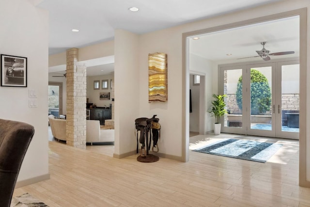 9 Swiftwater Trl, The Hills, TX 78738 - foyer entrance featuring ornate columns, ceiling fan, wood finished floors, french doors, and recessed lighting