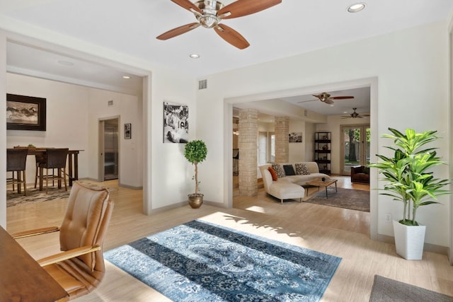 9 Swiftwater Trl, The Hills, TX 78738 - living room featuring a ceiling fan, light wood finished floors, and recessed lighting