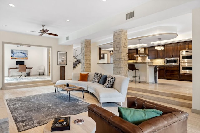 9 Swiftwater Trl, The Hills, TX 78738 - living area featuring decorative columns, light wood-style floors, a desk, a ceiling fan, and recessed lighting