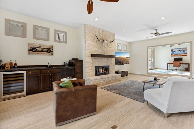 9 Swiftwater Trl, The Hills, TX 78738 - living area featuring beverage cooler, a ceiling fan, light wood-style flooring, and recessed lighting