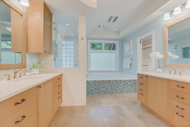 5412 Moon Shadow Dr, Austin, TX 78735 - bathroom featuring visible vents, tiled shower, and a sink