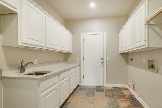 5412 Moon Shadow Dr, Austin, TX 78735 - clothes washing area featuring hookup for a washing machine, electric dryer hookup, cabinet space, stone finish flooring, and a sink