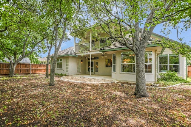 5412 Moon Shadow Dr, Austin, TX 78735 - back of house with a patio, a balcony, a ceiling fan, stucco siding, and fence
