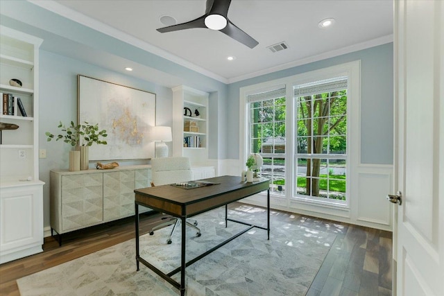 5412 Moon Shadow Dr, Austin, TX 78735 - home office with crown molding, built in shelves, visible vents, and wood finished floors