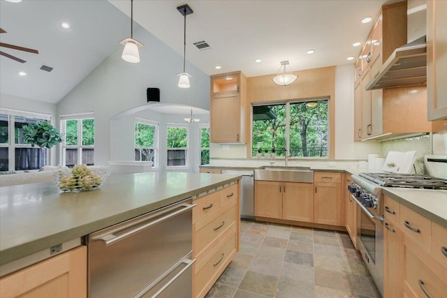 5412 Moon Shadow Dr, Austin, TX 78735 - kitchen featuring a sink, ceiling fan, stainless steel appliances, light brown cabinetry, and wall chimney exhaust hood