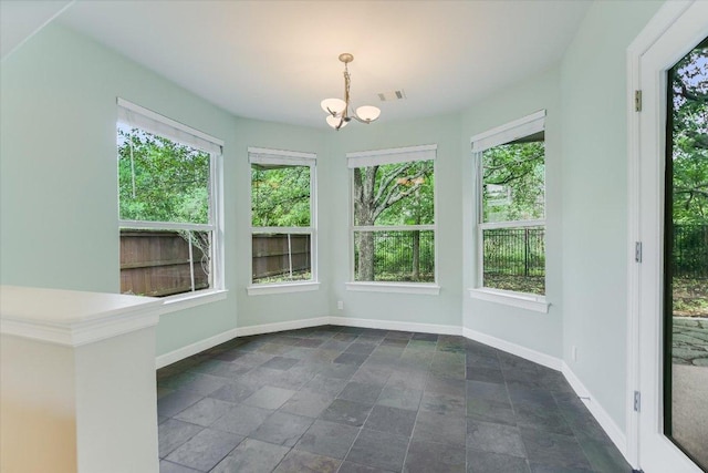 5412 Moon Shadow Dr, Austin, TX 78735 - unfurnished sunroom with stone finish floor, visible vents, a notable chandelier, and baseboards