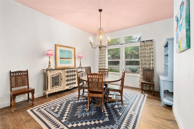10 Scarlet Rdg, Austin, TX 78737 - dining area featuring a chandelier, wood finished floors, and baseboards