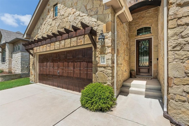 2421 Carretera Dr, Leander, TX 78641 - view of exterior entry featuring stone siding and driveway