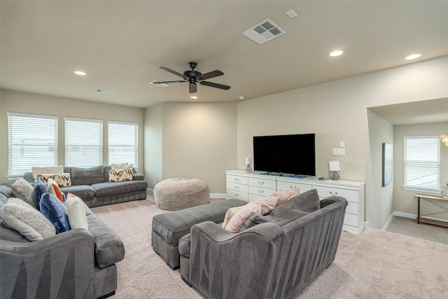 2421 Carretera Dr, Leander, TX 78641 - living area featuring light colored carpet, ceiling fan, recessed lighting, and plenty of natural light