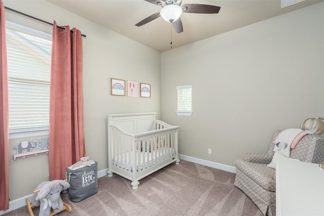2421 Carretera Dr, Leander, TX 78641 - bedroom featuring a crib, carpet, baseboards, and a ceiling fan