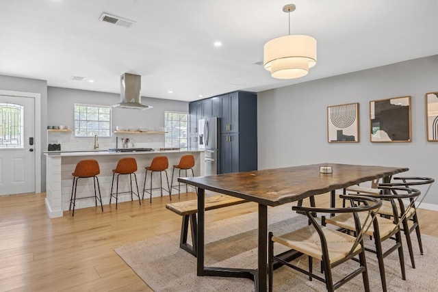 1712 Alleghany Dr, Austin, TX 78741 - dining area featuring light wood finished floors and recessed lighting