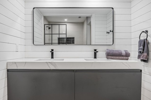 1712 Alleghany Dr, Austin, TX 78741 - bathroom featuring double vanity and tiled shower
