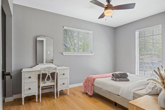 1712 Alleghany Dr, Austin, TX 78741 - bedroom featuring light wood-style floors, baseboards, and ceiling fan