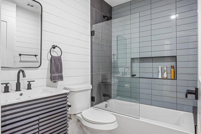 1712 Alleghany Dr, Austin, TX 78741 - full bathroom with combined bath / shower with glass door, toilet, and vanity