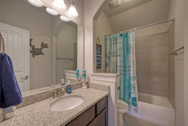 bathroom featuring tile patterned floors, shower / bathtub combination with curtain, toilet, and vanity