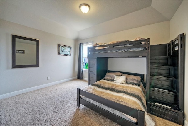 bedroom featuring carpet and baseboards