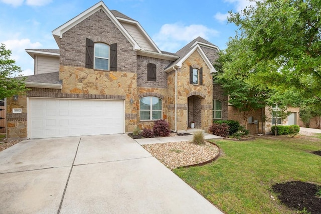 18617 Rio Chama Ln, Austin, TX 78738 - view of front of home featuring stone siding, concrete driveway, a front lawn, roof with shingles, and an attached garage