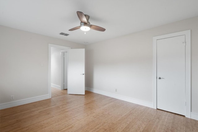 6405 Danwood Dr, Austin, TX 78759 - unfurnished bedroom featuring light wood finished floors and ceiling fan