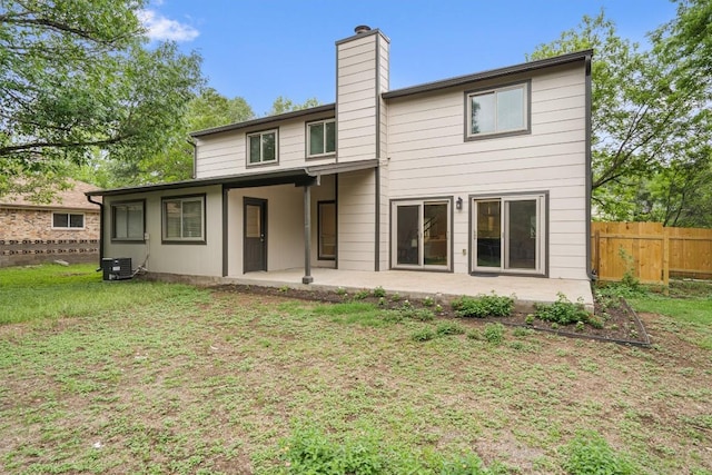 6405 Danwood Dr, Austin, TX 78759 - rear view of house featuring a chimney and a patio