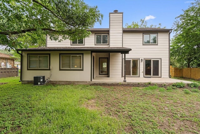 6405 Danwood Dr, Austin, TX 78759 - back of property featuring a patio and a chimney