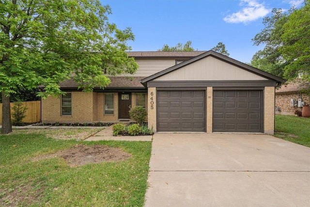 6405 Danwood Dr, Austin, TX 78759 - view of front of home featuring brick siding, an attached garage, driveway, and a shingled roof