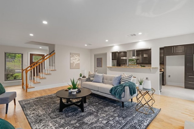 6405 Danwood Dr, Austin, TX 78759 - living area featuring light wood-type flooring, stairs, and recessed lighting