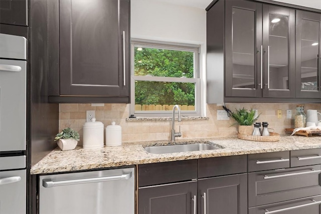 6405 Danwood Dr, Austin, TX 78759 - kitchen with appliances with stainless steel finishes, decorative backsplash, and glass insert cabinets
