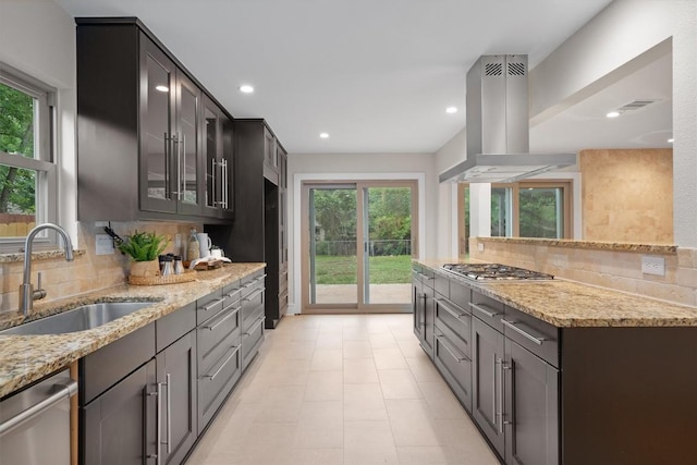 6405 Danwood Dr, Austin, TX 78759 - kitchen with island range hood, stainless steel appliances, plenty of natural light, backsplash, and recessed lighting