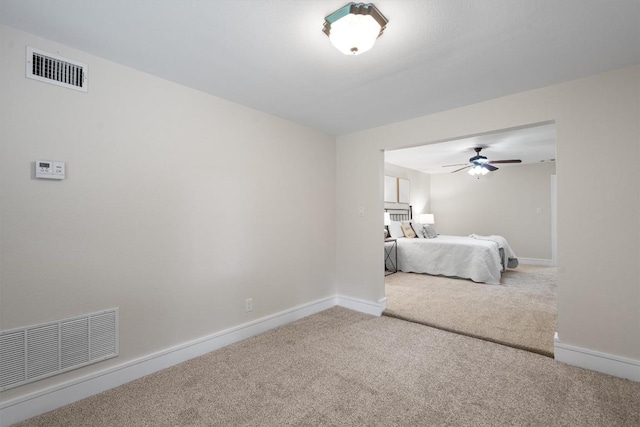 6405 Danwood Dr, Austin, TX 78759 - carpeted bedroom featuring baseboards and a ceiling fan