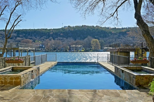 3111 Ski Shores Ter, Austin, TX 78730 - view of swimming pool with a pool with connected hot tub, a water and mountain view, and a forest view