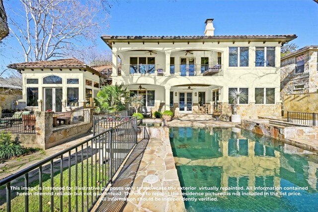 3111 Ski Shores Ter, Austin, TX 78730 - rear view of house featuring french doors, ceiling fan, a balcony, and a chimney