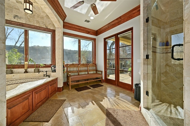 3111 Ski Shores Ter, Austin, TX 78730 - bathroom with stone tile flooring, crown molding, a ceiling fan, healthy amount of natural light, and a shower stall