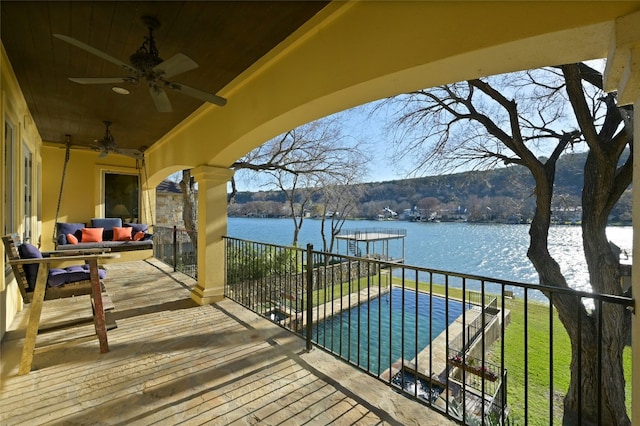 3111 Ski Shores Ter, Austin, TX 78730 - wooden deck with a water view, ceiling fan, outdoor lounge area, and a dock