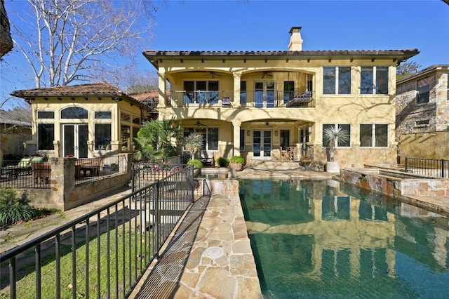 3111 Ski Shores Ter, Austin, TX 78730 - back of house featuring a balcony, french doors, a chimney, a patio area, and a ceiling fan