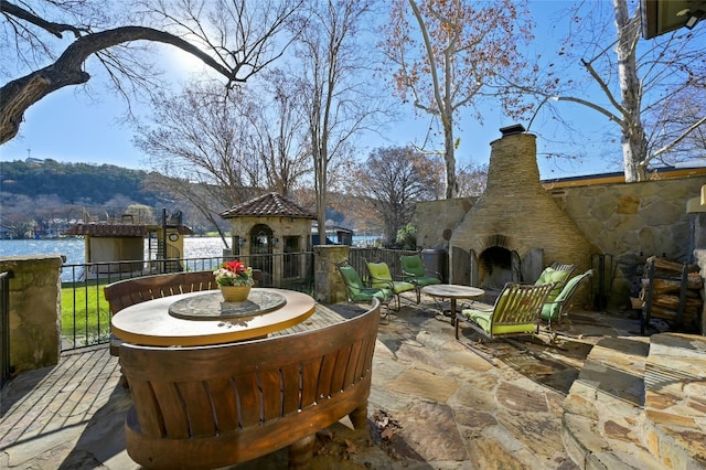 3111 Ski Shores Ter, Austin, TX 78730 - view of patio / terrace featuring exterior fireplace