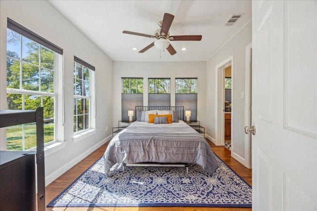 bedroom with visible vents, dark wood-style floors, baseboards, recessed lighting, and a ceiling fan