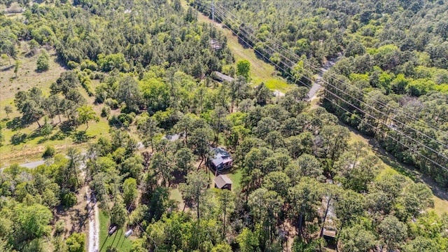 drone / aerial view featuring a view of trees