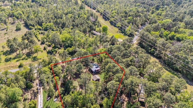 birds eye view of property with a forest view