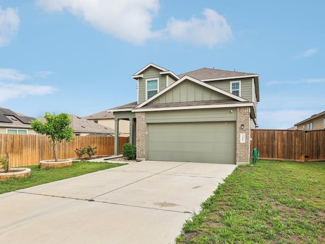 view of front of house with brick siding, a front lawn, and driveway