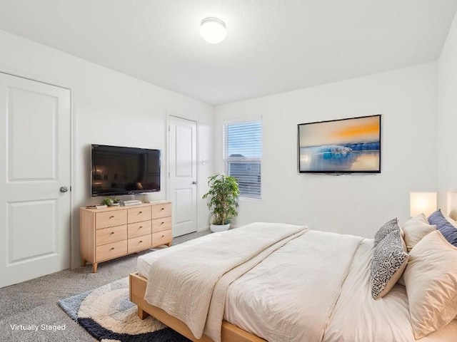 bedroom with light carpet