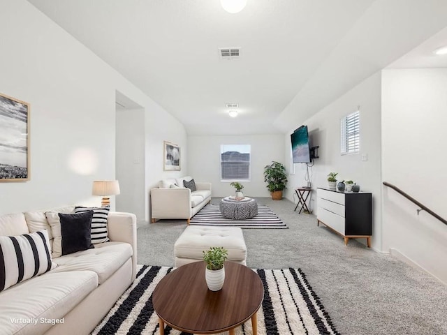carpeted living area featuring visible vents