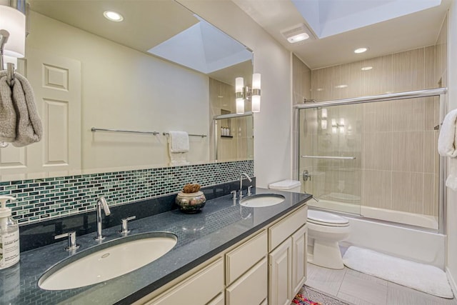 609 E Briarway Dr, Granite Shoals, TX 78654 - bathroom with bath / shower combo with glass door, double vanity, tasteful backsplash, recessed lighting, and tile patterned flooring
