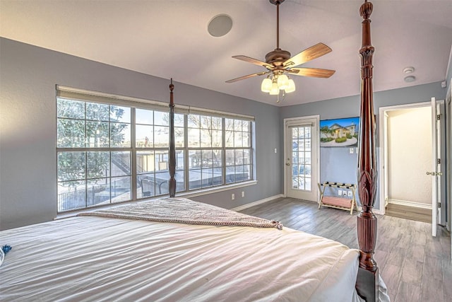 609 E Briarway Dr, Granite Shoals, TX 78654 - bedroom featuring baseboards, wood finished floors, a ceiling fan, and access to exterior