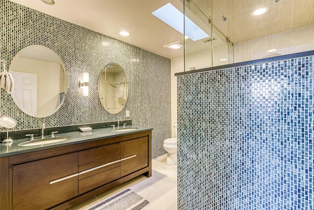 609 E Briarway Dr, Granite Shoals, TX 78654 - full bathroom with toilet, tile walls, a sink, and tiled shower